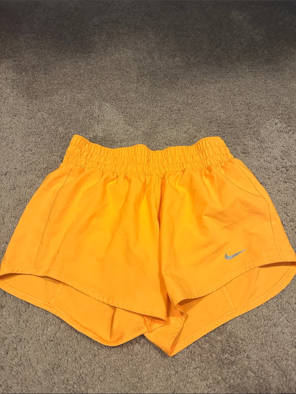 Nike Women's Bright Orange Athletic Shorts with Silver Swoosh